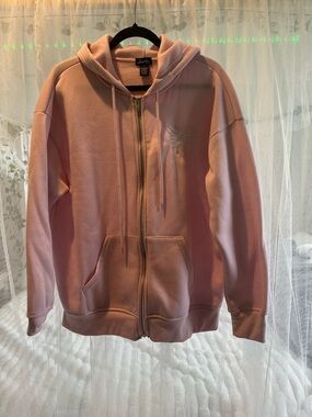 Women’s pink and white size large zip up hoodie